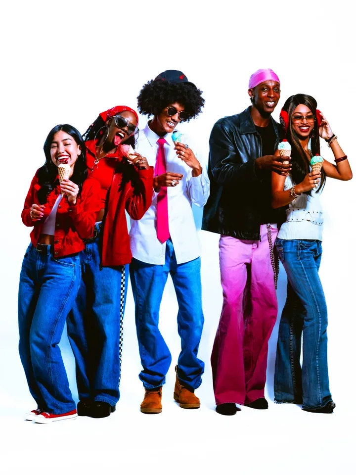 Group holding Cheaters Creamery ice cream in a brand photograph